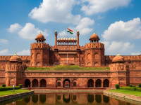 Majestic Red Sandstone Mughal Fort With Indian Flag and Reflective Moat.jpeg